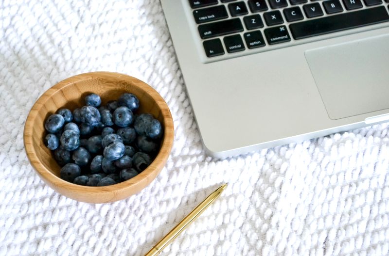 laptop and blueberries